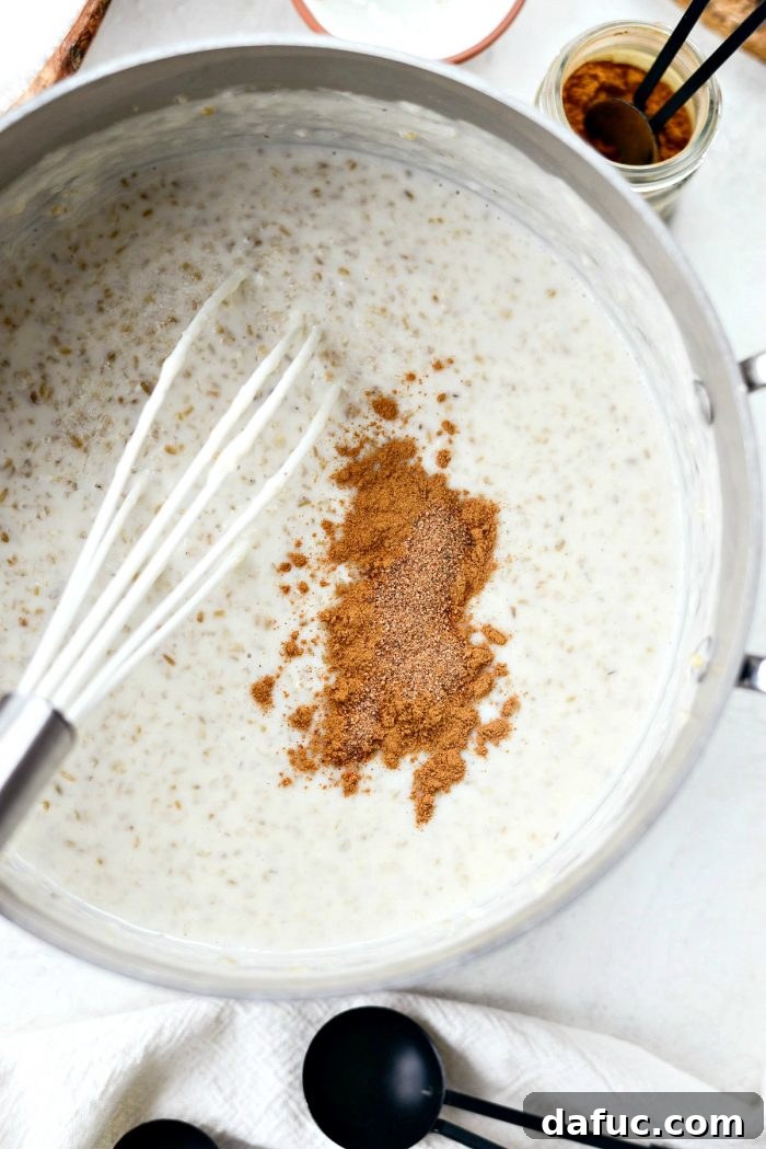 Zesty Cranberry Orange Steel Cut Oats 10 Steel cut oats simmering further, becoming thick and creamy with spices.