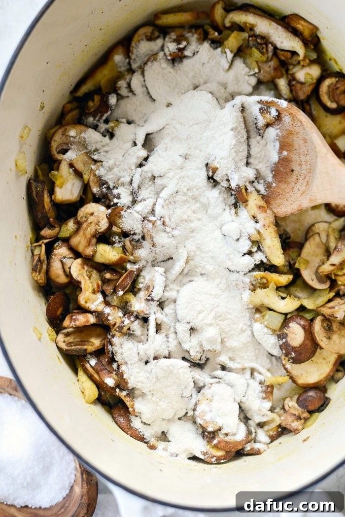 Flour sprinkled over sautéed mushrooms and spices to create a roux for thickening the soup