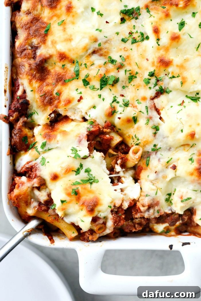 Spicy Italian Sausage Baked Ziti: Layers of pasta, meat sauce, ricotta, and mozzarella