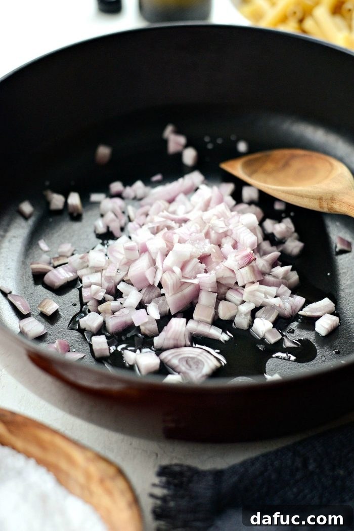 Shallots and garlic cooking in olive oil for the baked ziti sauce
