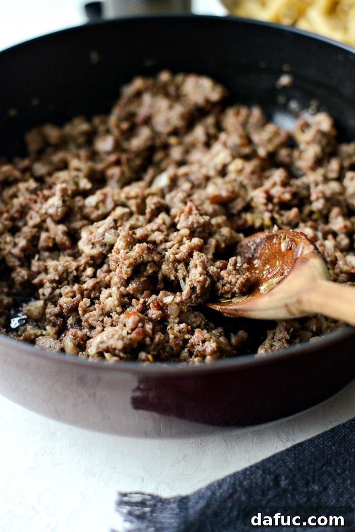 Browning spicy Italian sausage and lean ground beef