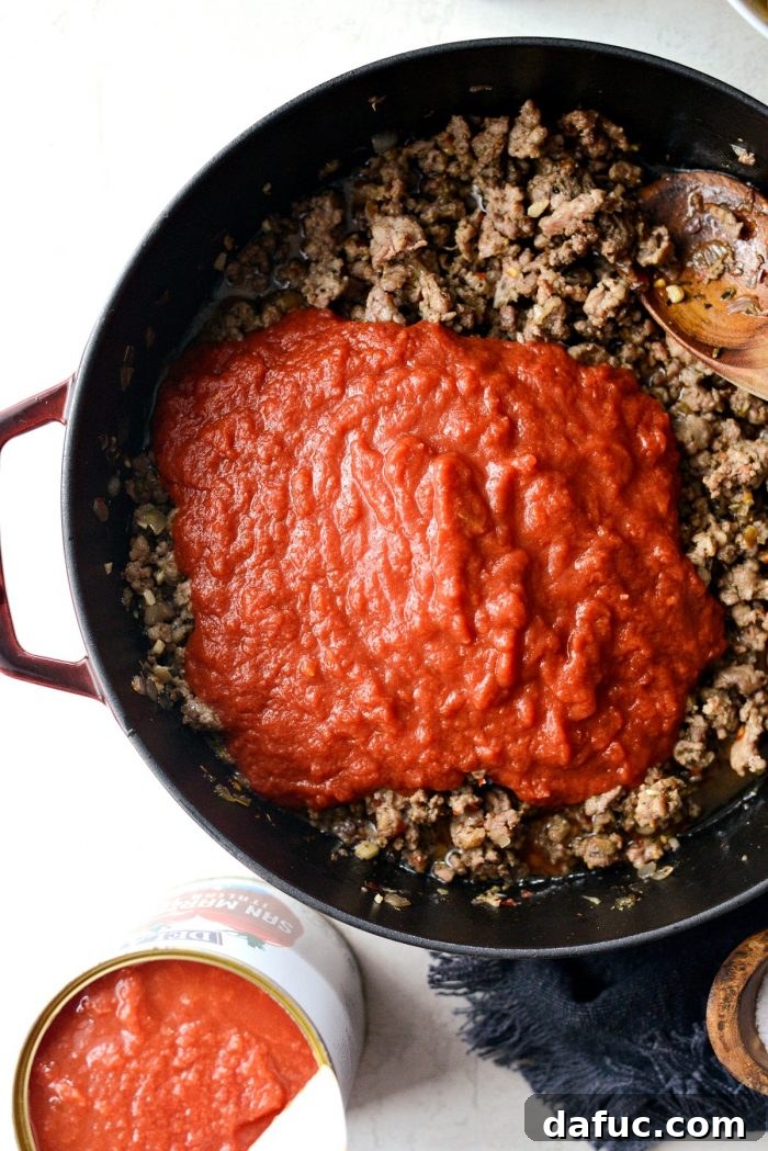 Simmering the rich meat sauce to perfection