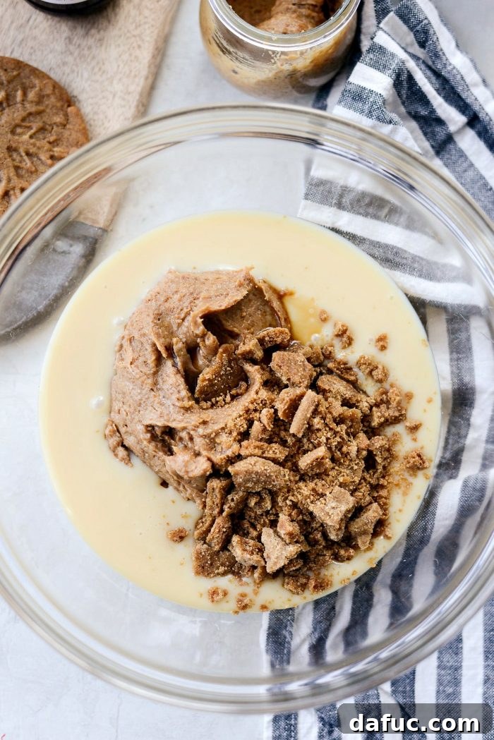 Creamy No-Churn Belgian Cookie Butter Delight 6 Whipping heavy cream in a large chilled bowl until stiff peaks form