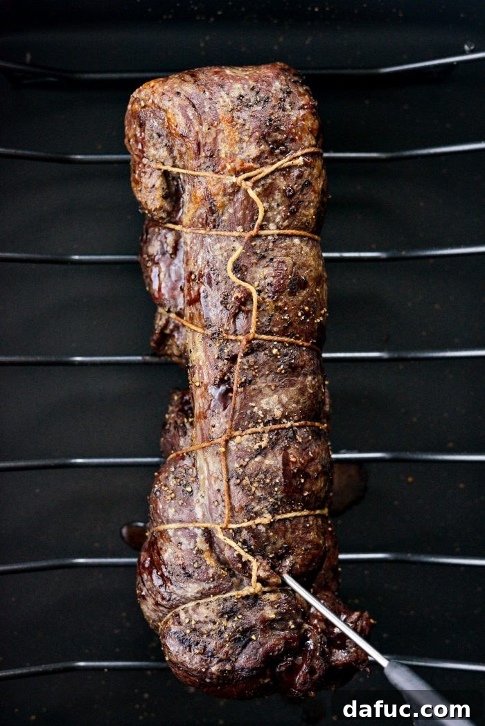 Peppercorn Crusted Beef Tenderloin 14 Resting beef tenderloin after roasting, tented with foil.