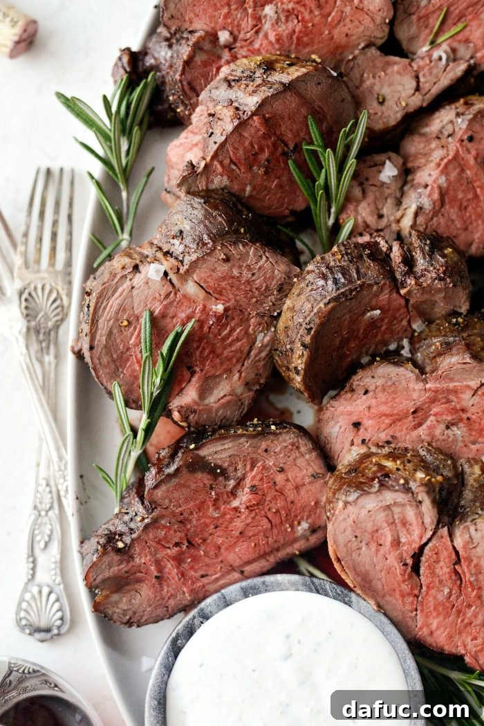Peppercorn Crusted Beef Tenderloin 16 Close-up of Black Pepper Crusted Beef Tenderloin slices with horseradish sauce.