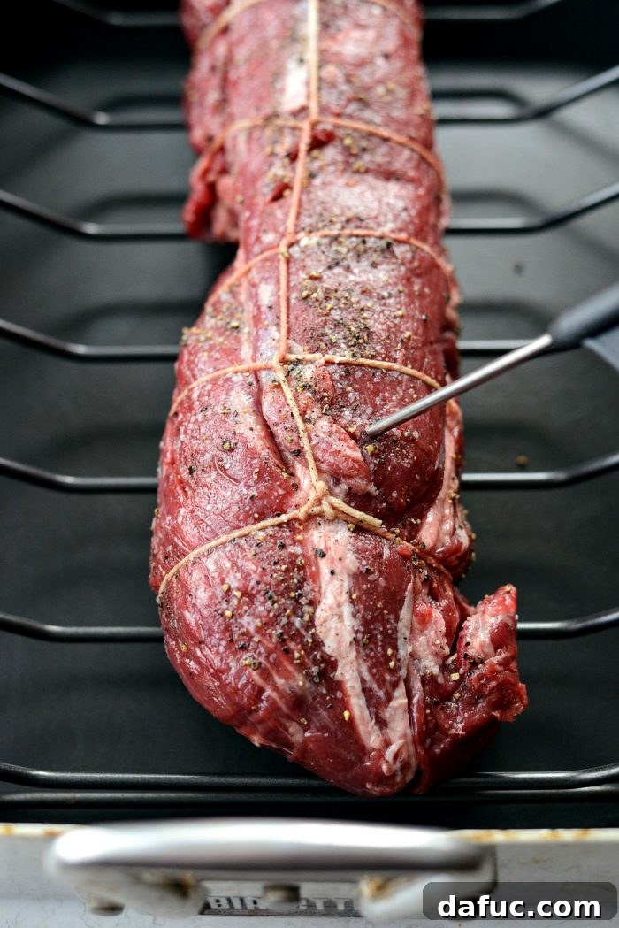 Peppercorn Crusted Beef Tenderloin 7 Inserting an oven-safe digital thermometer into the thickest part of the tenderloin.