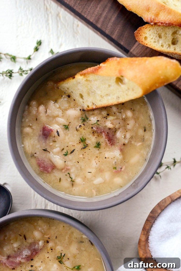 Hearty Ham and White Bean Soup 2 Homemade White Bean and Ham Soup, a perfect comforting meal made from scratch with leftover ham bone.