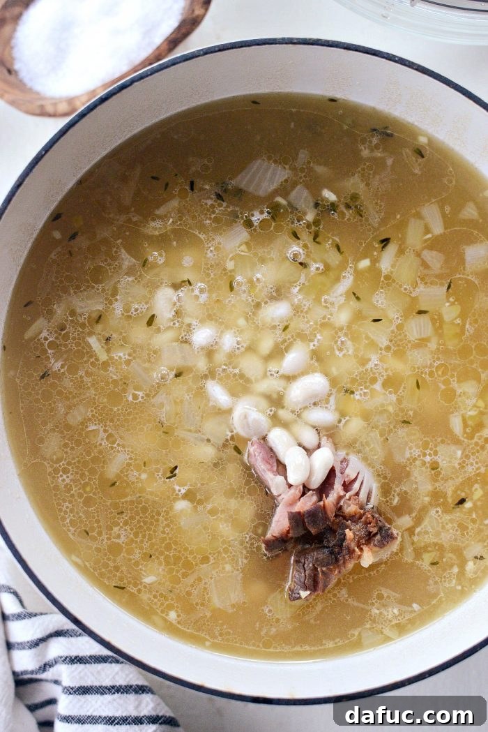 Hearty Ham and White Bean Soup 11 Drained white beans added to the simmering ham and broth mixture.
