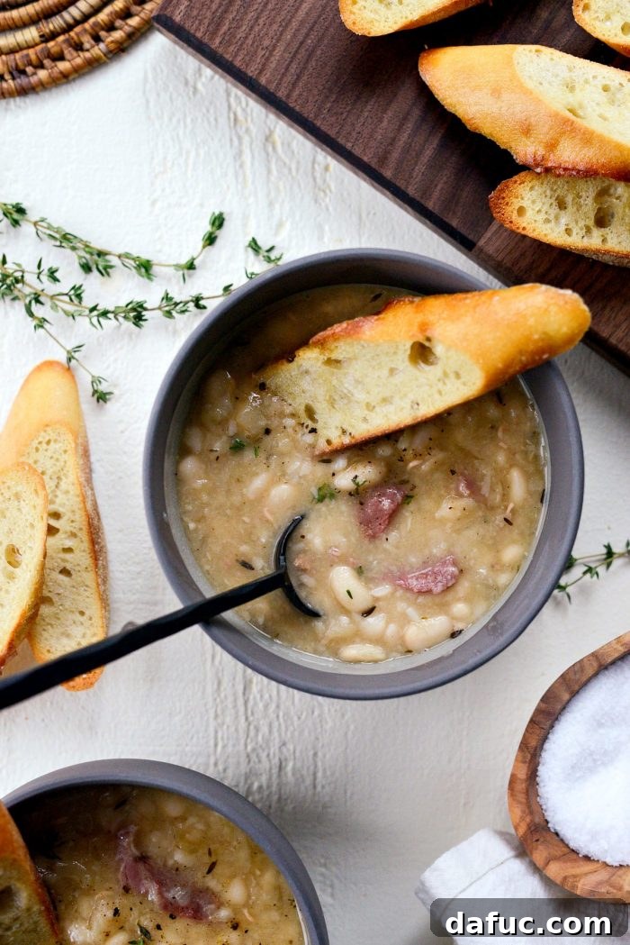 Hearty Ham and White Bean Soup 20 The final presentation of a bowl of homemade Ham and White Bean Soup, rich and inviting.