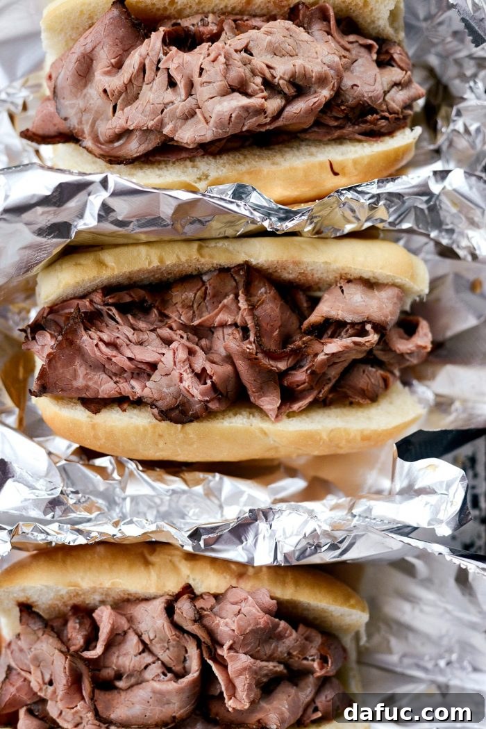 Effortless French Dip Delights 11 Thinly sliced roast beef being gently warmed in the savory au jus in a pan
