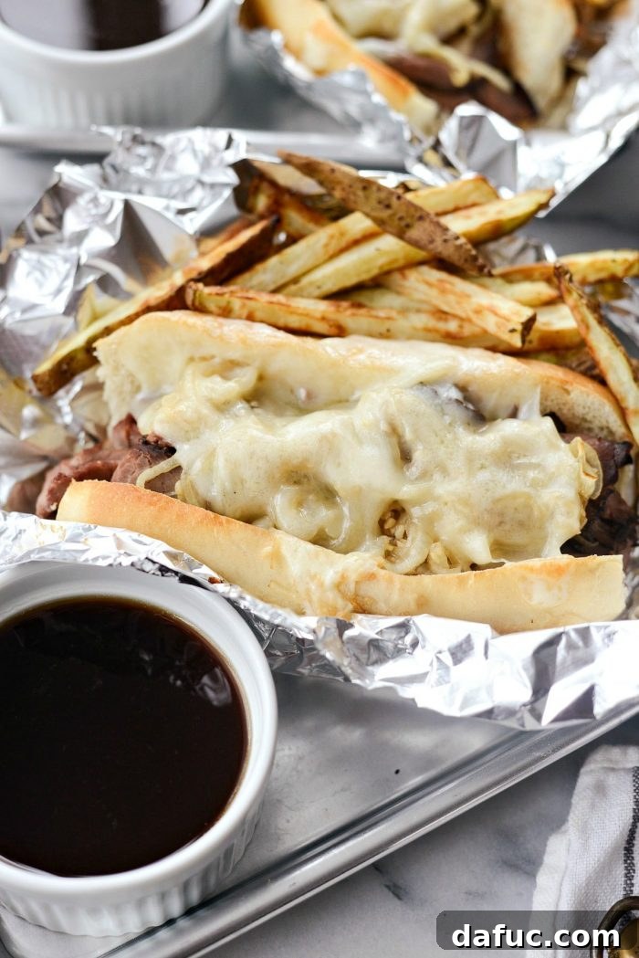 Effortless French Dip Delights 16 Savory au jus ladled into individual ramekins for dipping French Dip sandwiches
