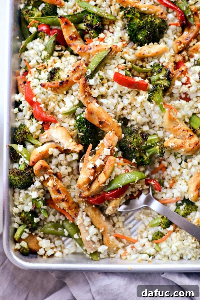 Delicious and healthy sheet pan teriyaki chicken and cauliflower rice, perfectly cooked and ready to serve.
