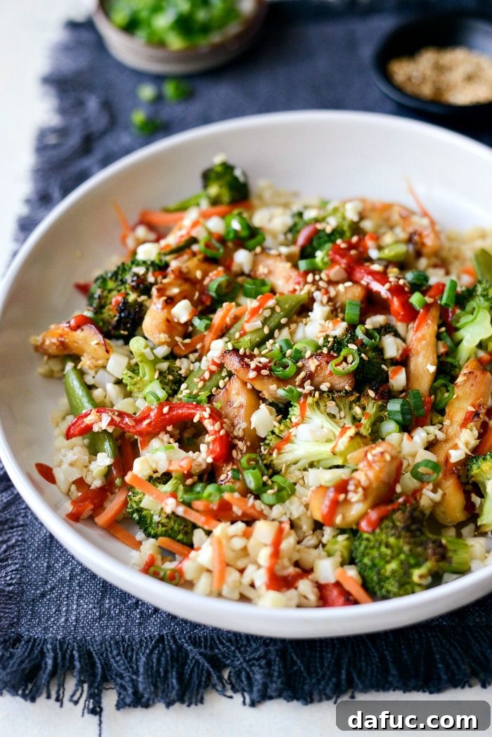 Final presentation of Sheet Pan Teriyaki Chicken and Cauliflower Rice, beautifully arranged with fresh garnishes.
