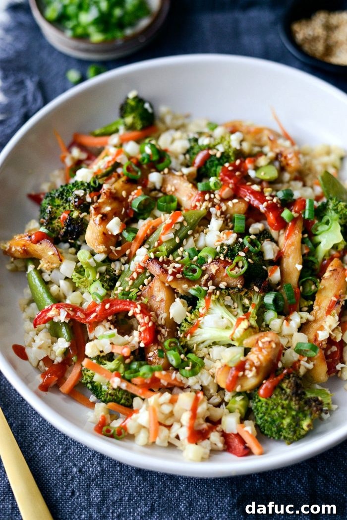 Healthy Sheet Pan Dinner featuring Teriyaki Chicken and Cauliflower Rice, perfect for meal prep.