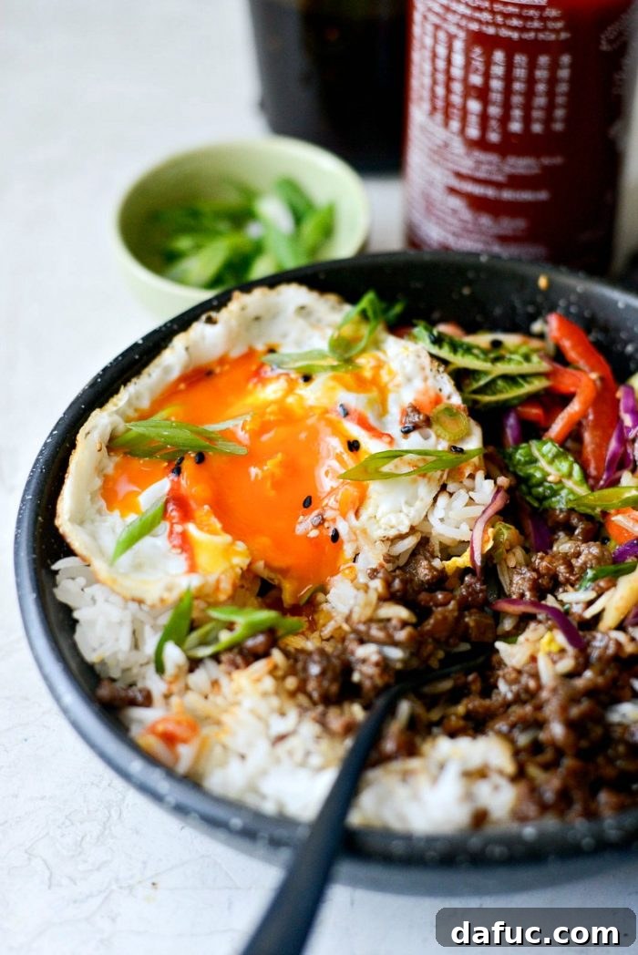 Bulgogi Power Bowls 11 Fully assembled Korean BBQ Beef Bowl with fried egg, rice, slaw, and green onions, ready to eat