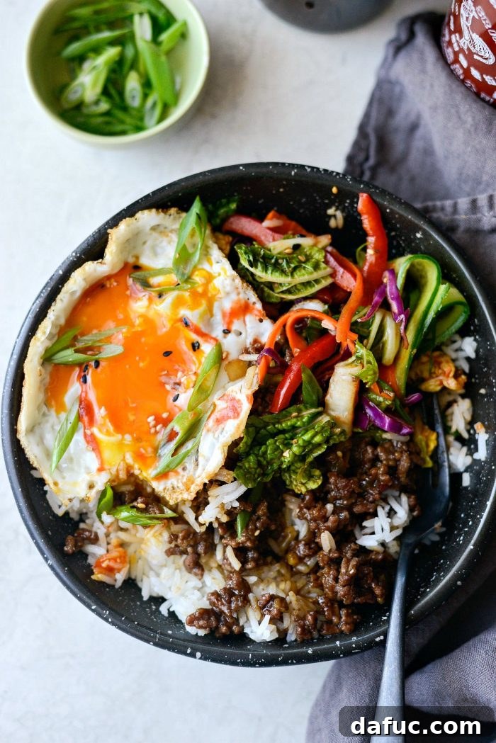Bulgogi Power Bowls 12 Close-up of a Korean BBQ Beef Bowl, highlighting the runny yolk and inviting texture of the beef