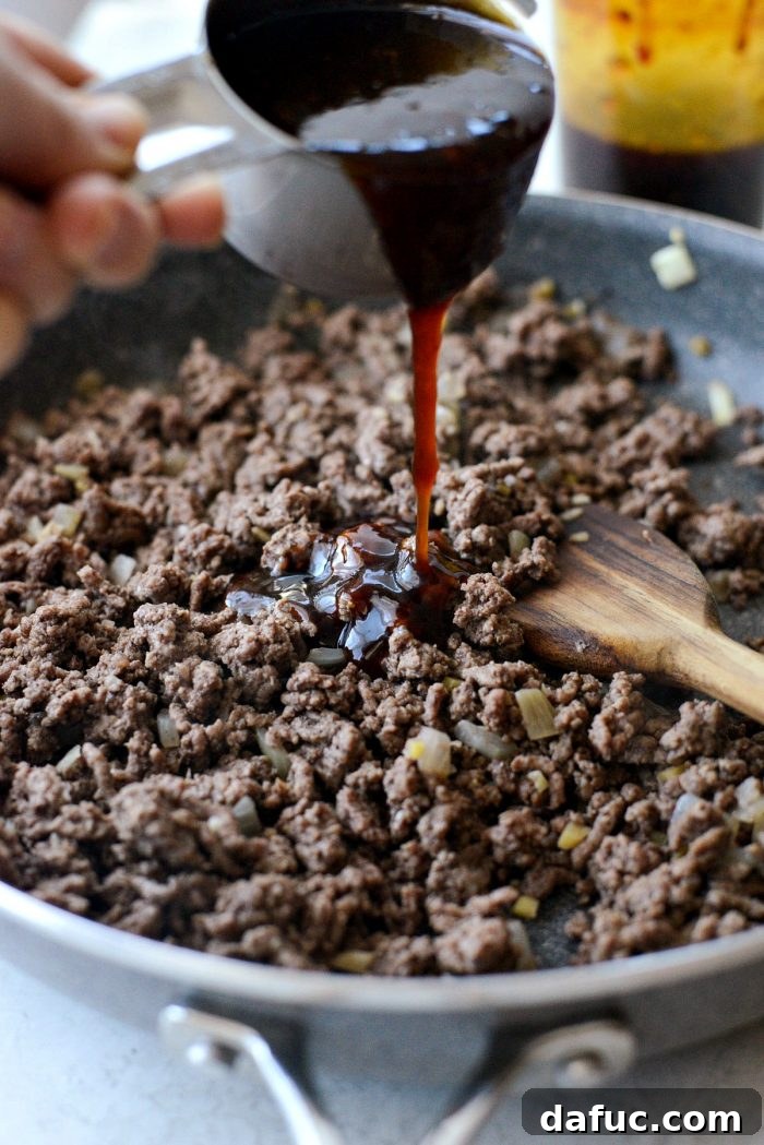 Bulgogi Power Bowls 7 Lean ground beef browning in a skillet with sautéed aromatics, ready for the sauce