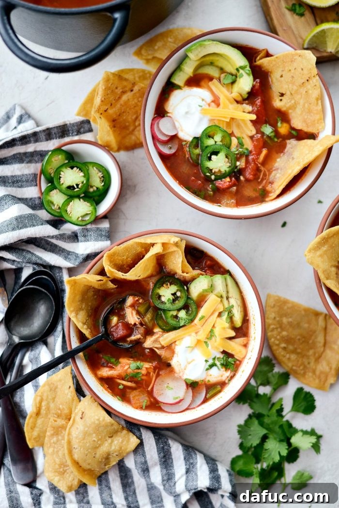 Effortless Chicken Tortilla Soup Delight 16 Close-up of a serving of Chicken Tortilla Soup with a focus on its rich texture and steam, emphasizing its warmth.