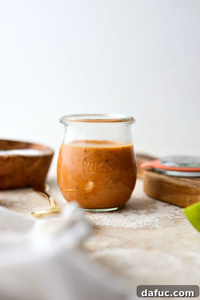 Sweet Heat Chipotle Vinaigrette 6 A glass jar filled with freshly made Chipotle Honey Vinaigrette, ready for storage or serving.