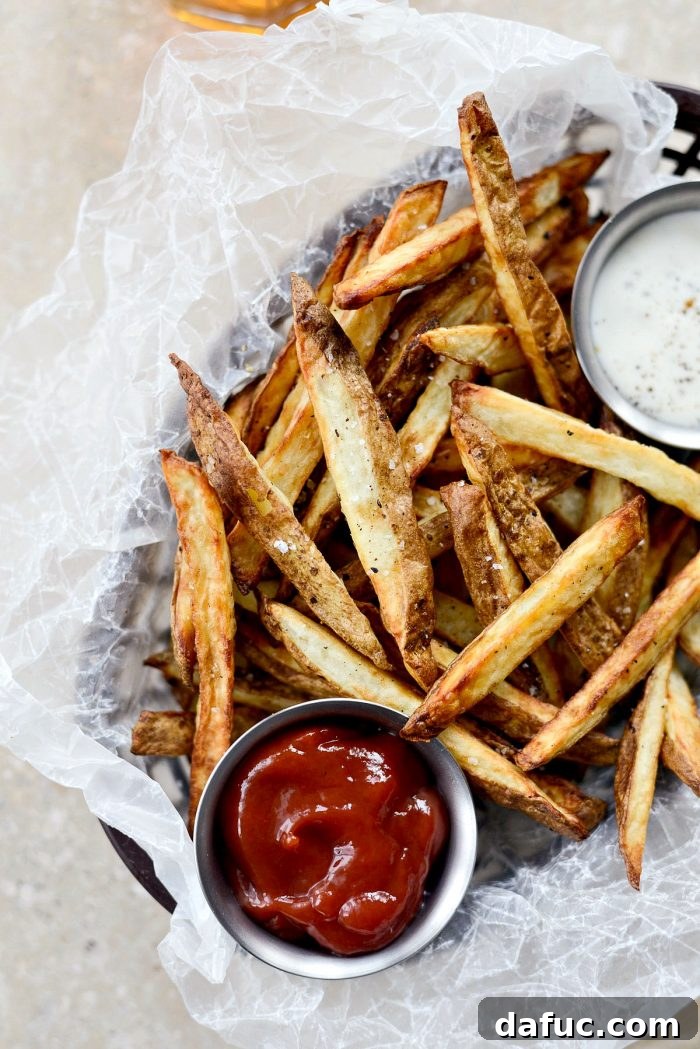 Crispy Homemade Air Fryer Fries 14 A close-up of a large serving of crispy Air Fryer French Fries, golden and perfectly seasoned