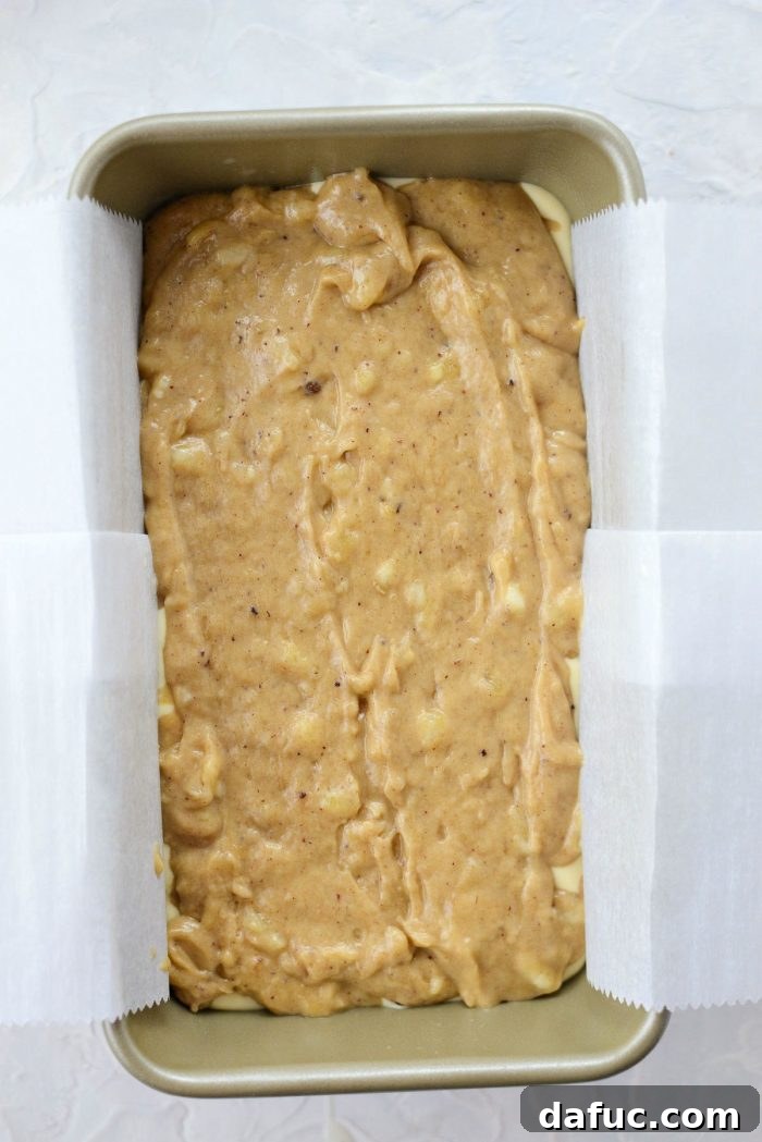 Cream Cheese Swirled Banana Bread 16 Layering banana bread batter and cheesecake filling