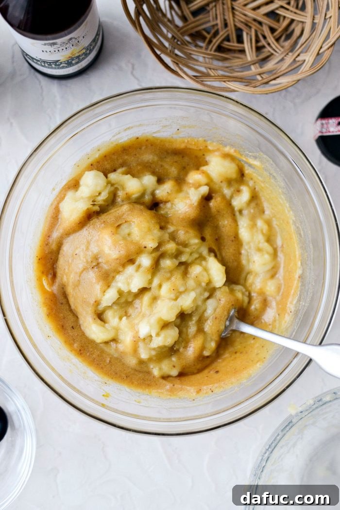 Cream Cheese Swirled Banana Bread 10 Whisking wet ingredients for banana bread