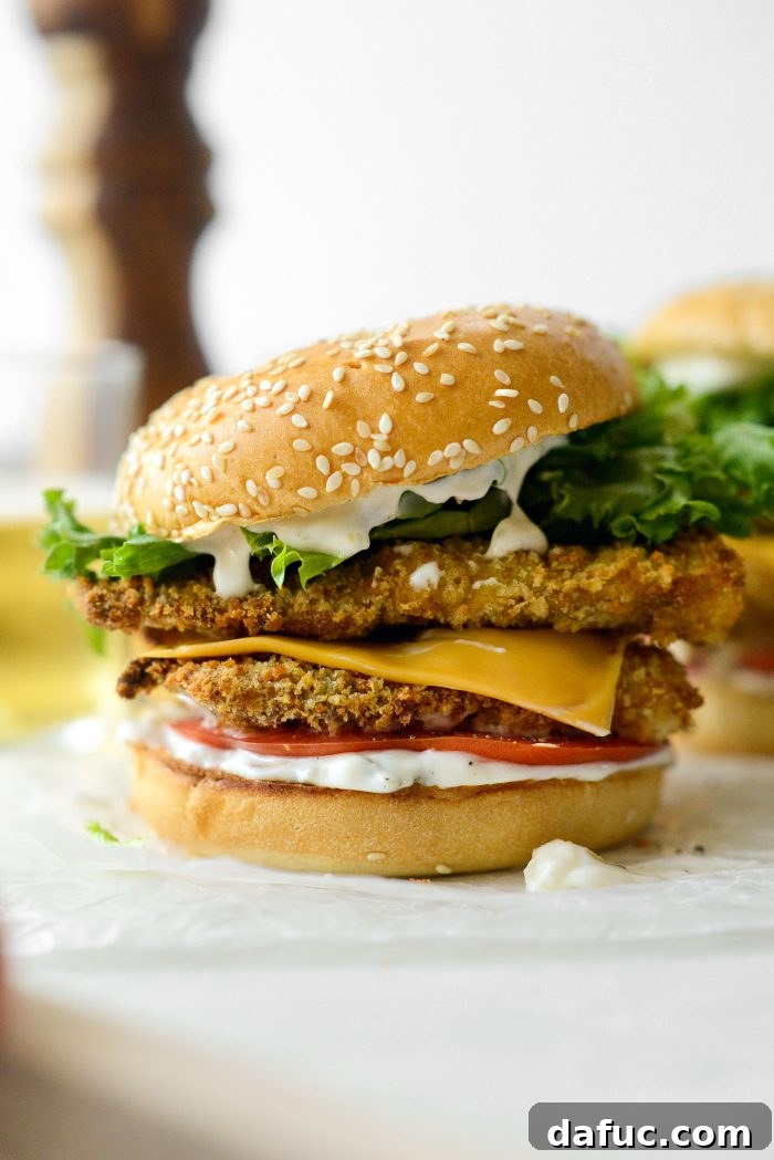 Golden Crispy Fish Sandwiches 2 Crispy Fish Sandwich on a toasted brioche bun with cheese, lettuce, and tomato