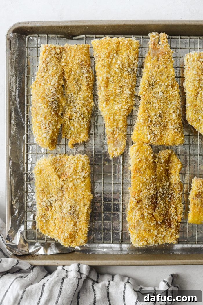 Golden Crispy Fish Sandwiches 14 Spraying breaded fish fillets with oil