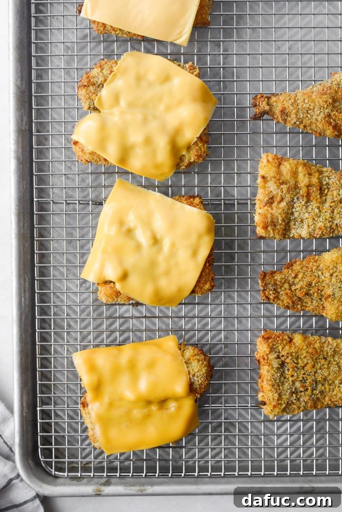 Golden Crispy Fish Sandwiches 17 Placing cheese on hot fish fillets to melt