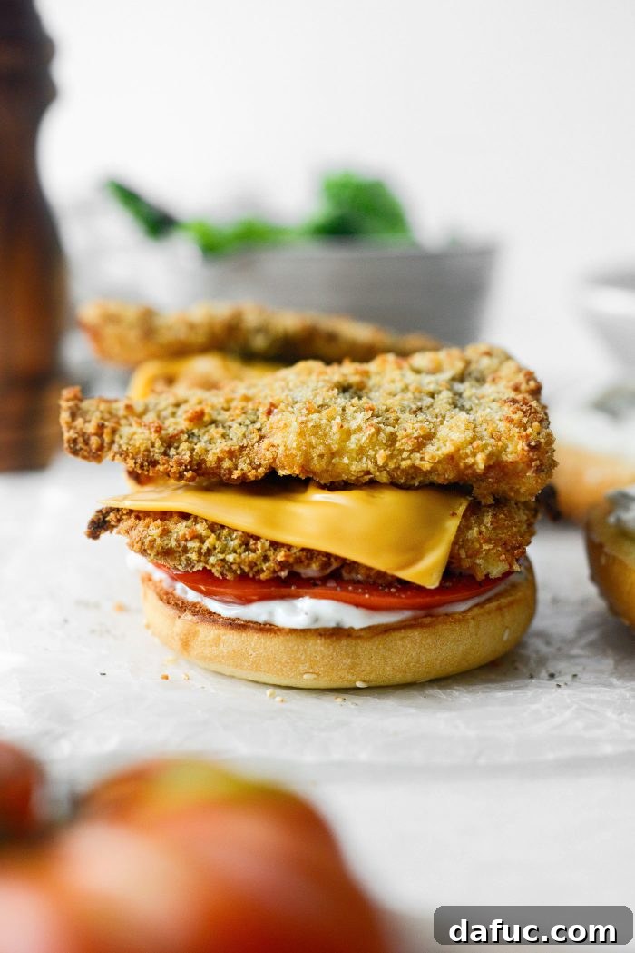 Golden Crispy Fish Sandwiches 21 Adding crispy fish fillets on top of tomato slice