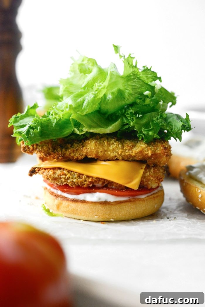 Golden Crispy Fish Sandwiches 22 Piling crispy lettuce on top of the fish fillets