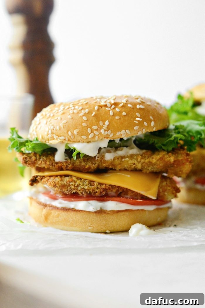 Golden Crispy Fish Sandwiches 23 Adding the top bun to complete the Crispy Fish Sandwich