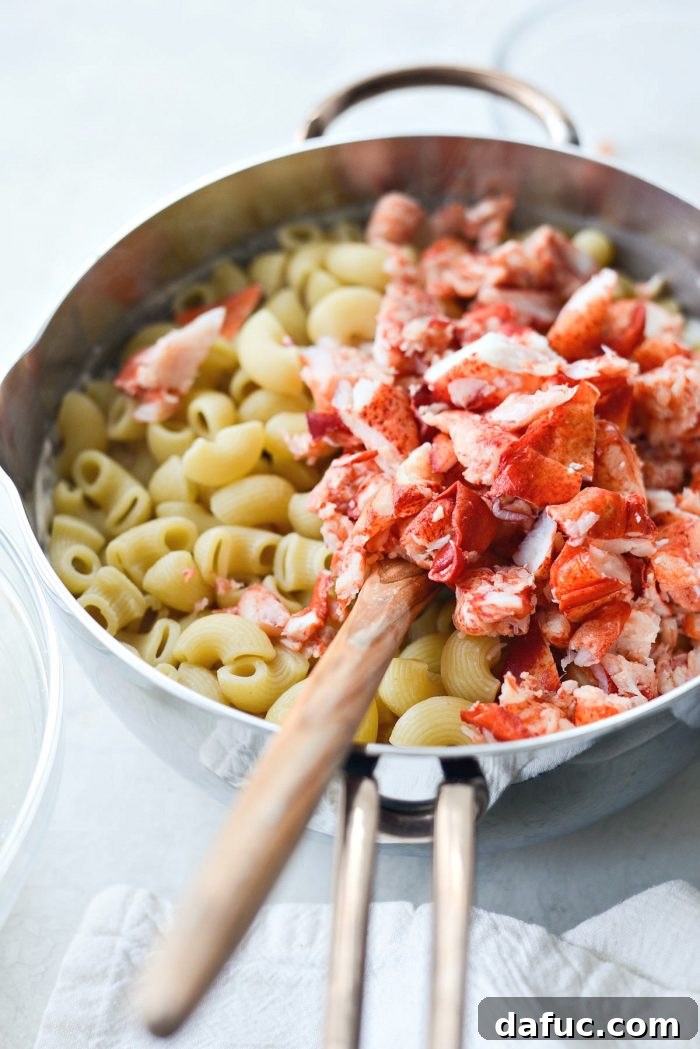 Opulent Lobster Mac and Cheese 15 Drained cooked pasta in a colander, ready to be combined with the sauce.