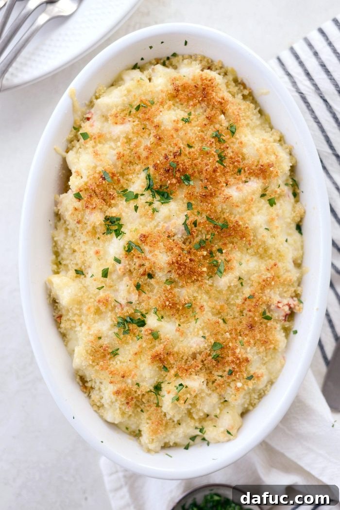 Opulent Lobster Mac and Cheese 22 Lobster Mac and Cheese topped with panko breadcrumb mixture, ready for baking.