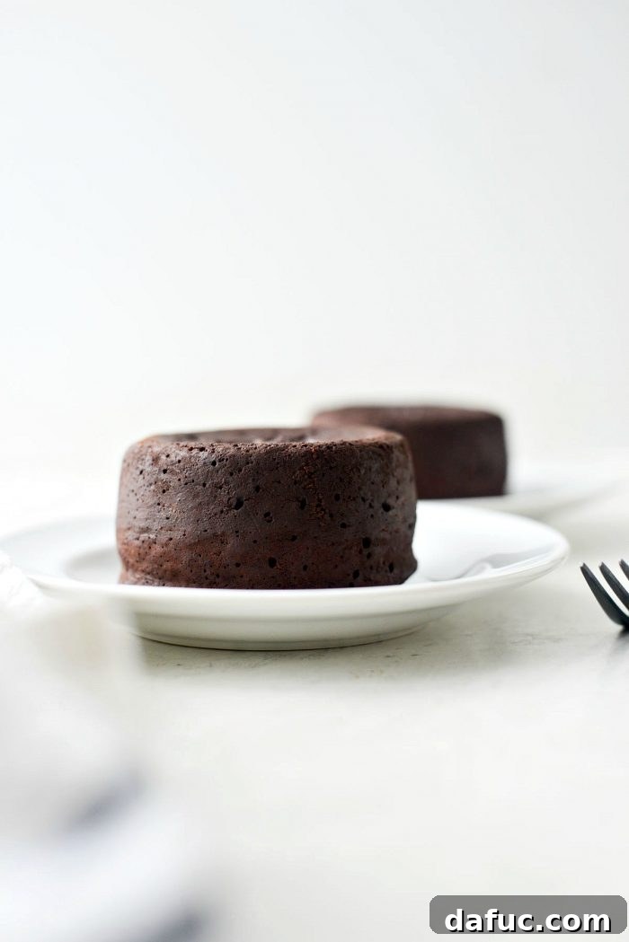 A perfectly unmolded molten chocolate lava cake, ready for garnishing and serving