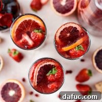 Champagne Sangria with fresh fruit and bubbly rosé, a refreshing adult beverage.