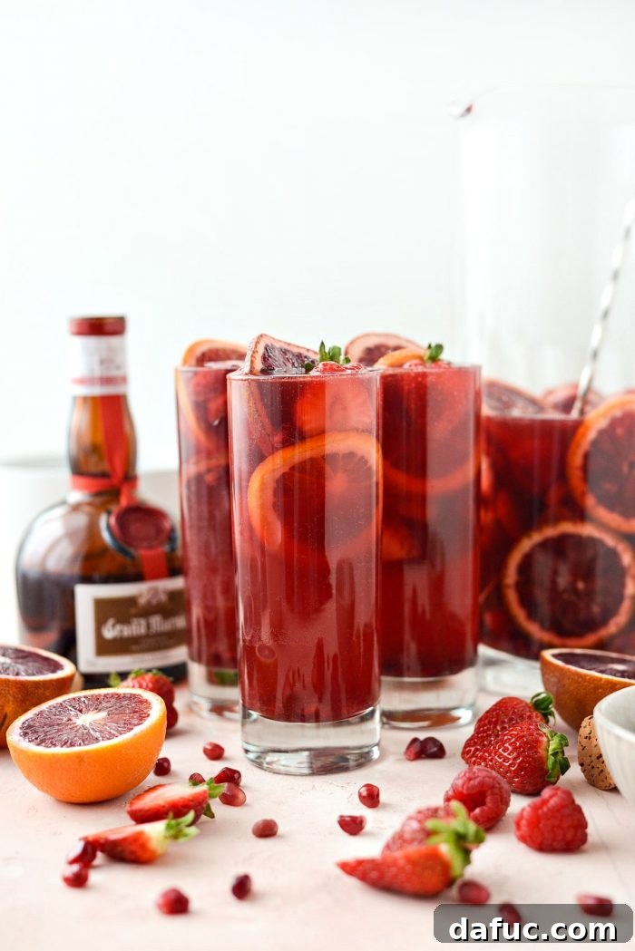 Champagne Sangria served in glasses with a beautiful backdrop, highlighting the festive atmosphere and inviting presentation.