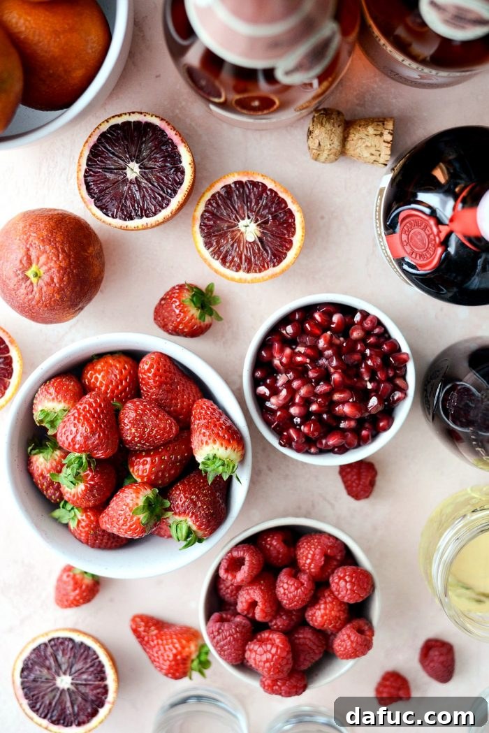 A glass of Champagne Sangria, garnished with fresh fruit, ready to be enjoyed as a refreshing adult beverage.
