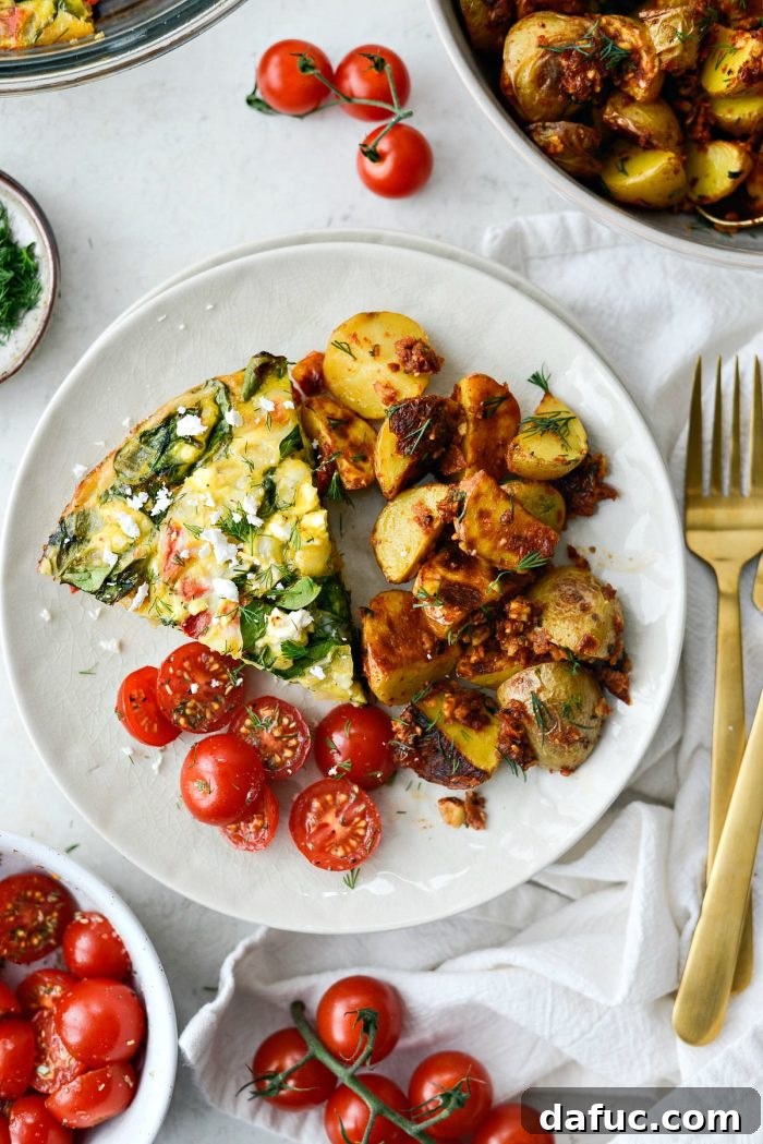 Delicious Tomato Spinach and Feta Crustless Quiche, a healthy and low-carb breakfast or brunch option.