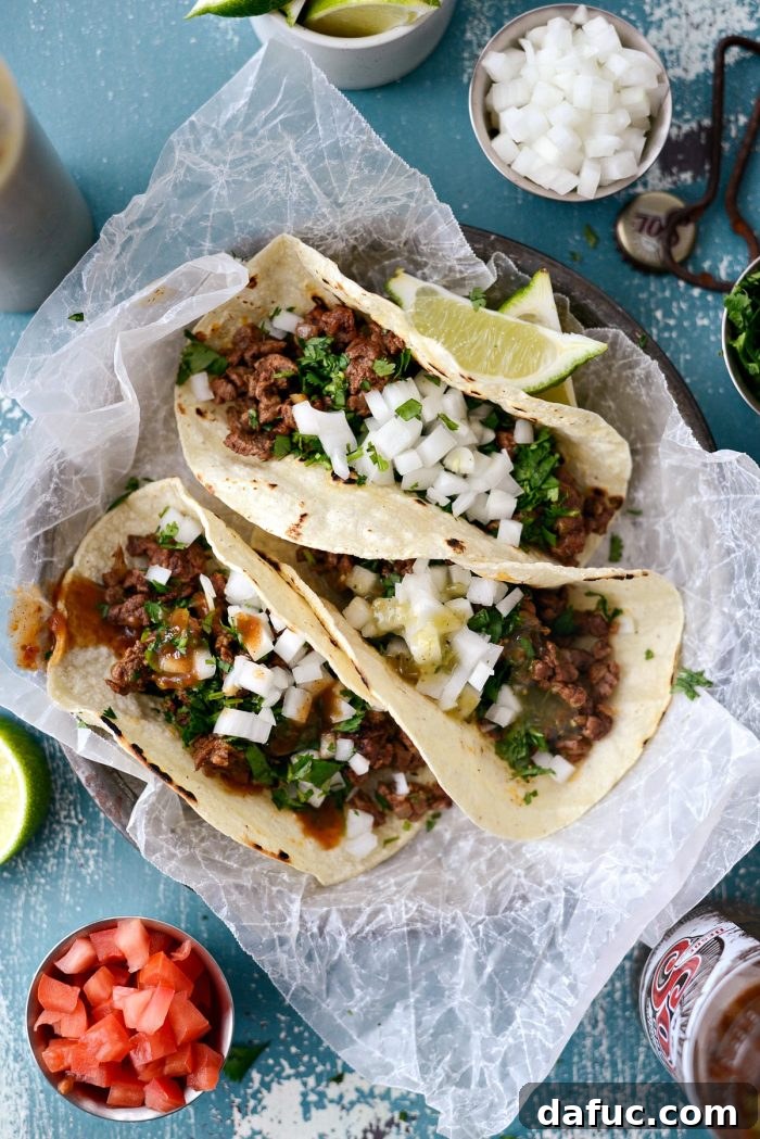 Easy Beef Street Tacos with finely minced skirt steak, simple toppings of white onion and cilantro. Perfect for Taco Tuesday. SimplyScratch.com recipe.