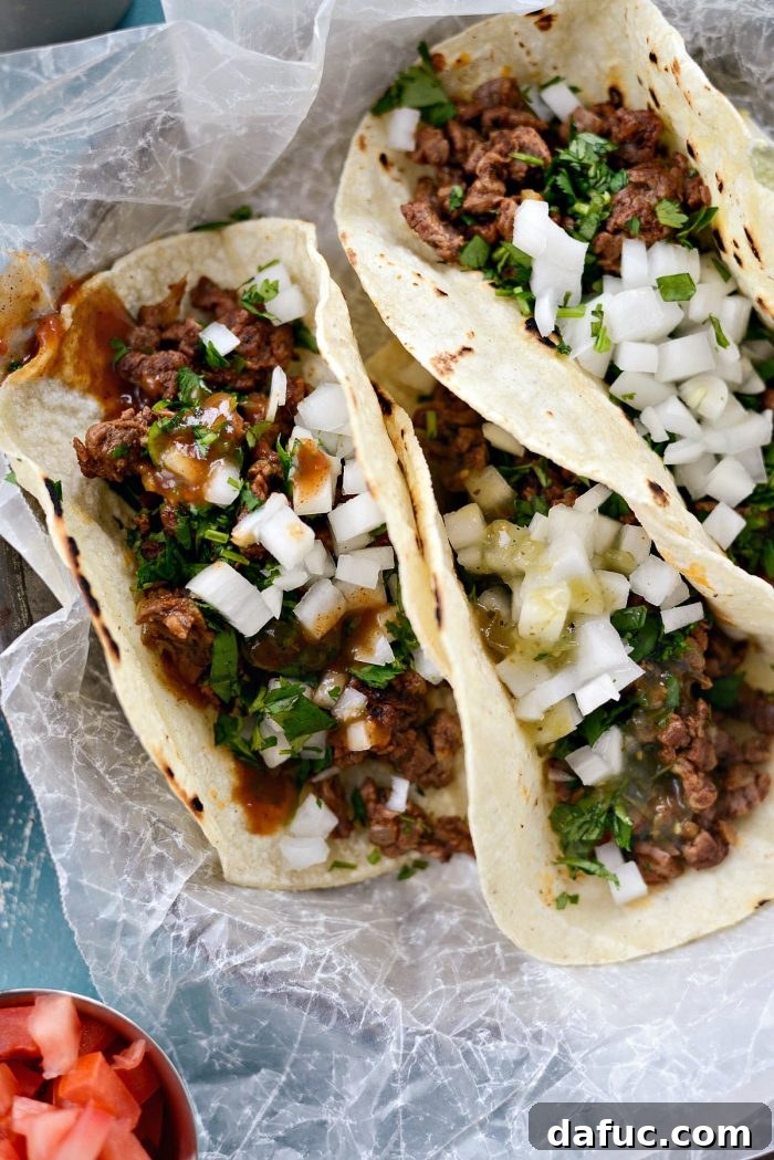 A close-up shot of a finished Easy Beef Street Taco, ready to be enjoyed. SimplyScratch.com recipe.