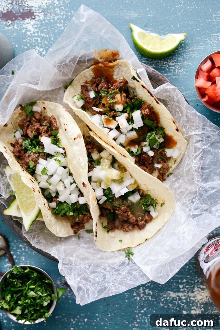 Plated Easy Beef Street Tacos with an enticing angle, ready for serving. SimplyScratch.com recipe.