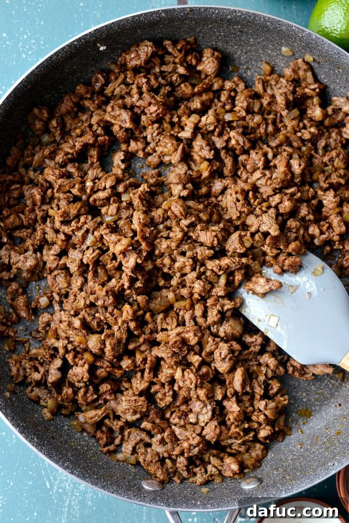Cooked and seasoned beef filling for street tacos, ready to be served. SimplyScratch.com recipe.