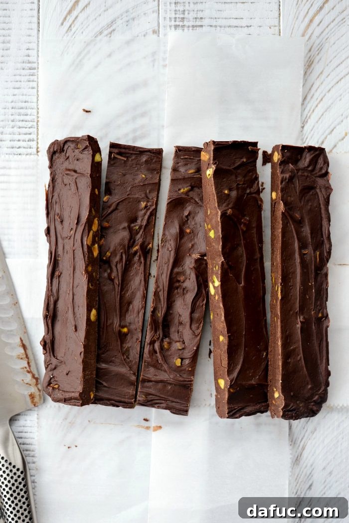 Set Baileys Chocolate Pistachio Fudge being lifted out of the pan.
