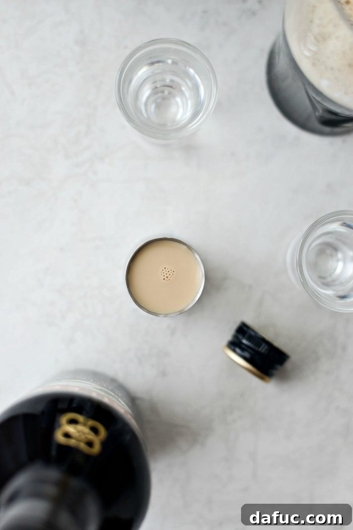 Emerald Slam 5 Measuring Bailey's Irish Cream into a shot glass