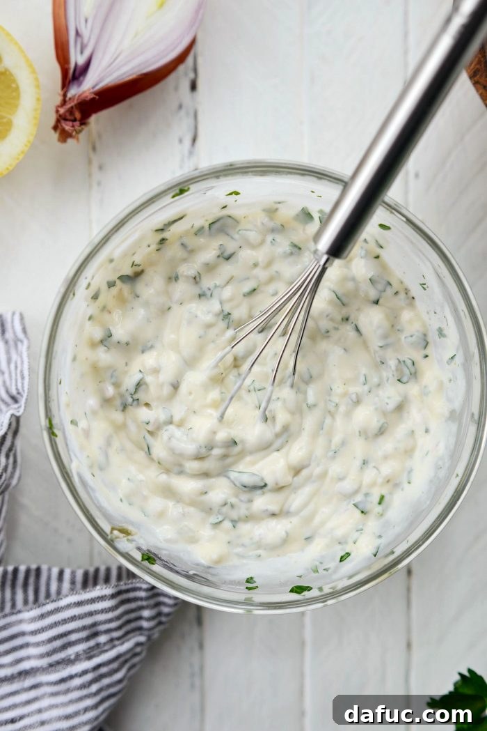 Golden Baked Maryland Crab Delights 6 Creamy homemade tartar sauce in a bowl, ready for chilling.