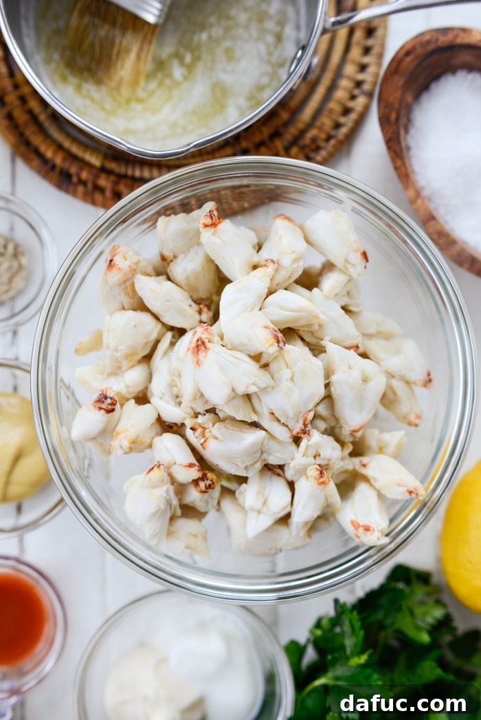 Golden Baked Maryland Crab Delights 7 Close-up of fresh, raw jumbo lump crab meat, the star ingredient for Maryland crab cakes.