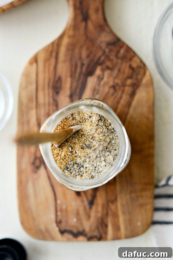 A close-up of the fully mixed Homemade Lemon Pepper Seasoning in a glass bowl.