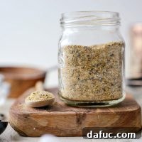 Homemade Lemon Pepper Seasoning in a glass jar, ready to be used.