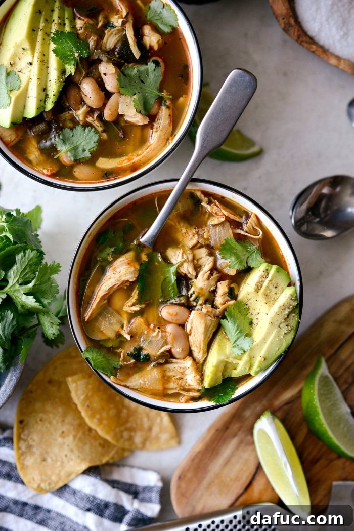 Hearty Poblano Chicken and White Bean Stew 20 White Bean Chicken Poblano Stew in a large pot, with a ladle